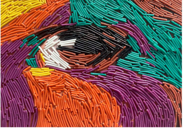 Close-up of an eye rendered entirely from small pieces of coloured wire